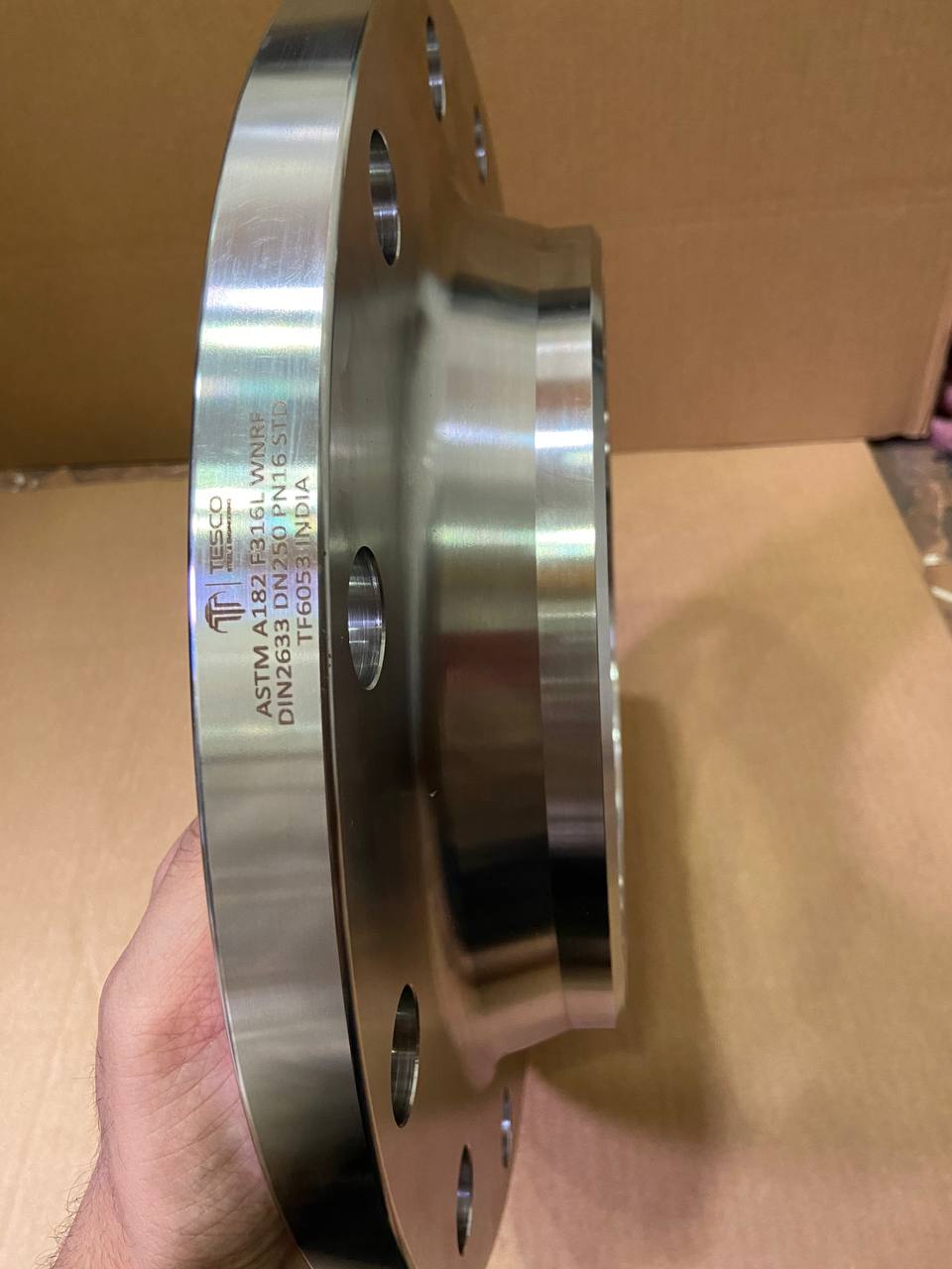 ASTM A182 F316L stainless steel weld neck raised face flange DIN 2633 DN250 PN16 — side view showing hub and raised face profile, Tesco Steel & Engineering