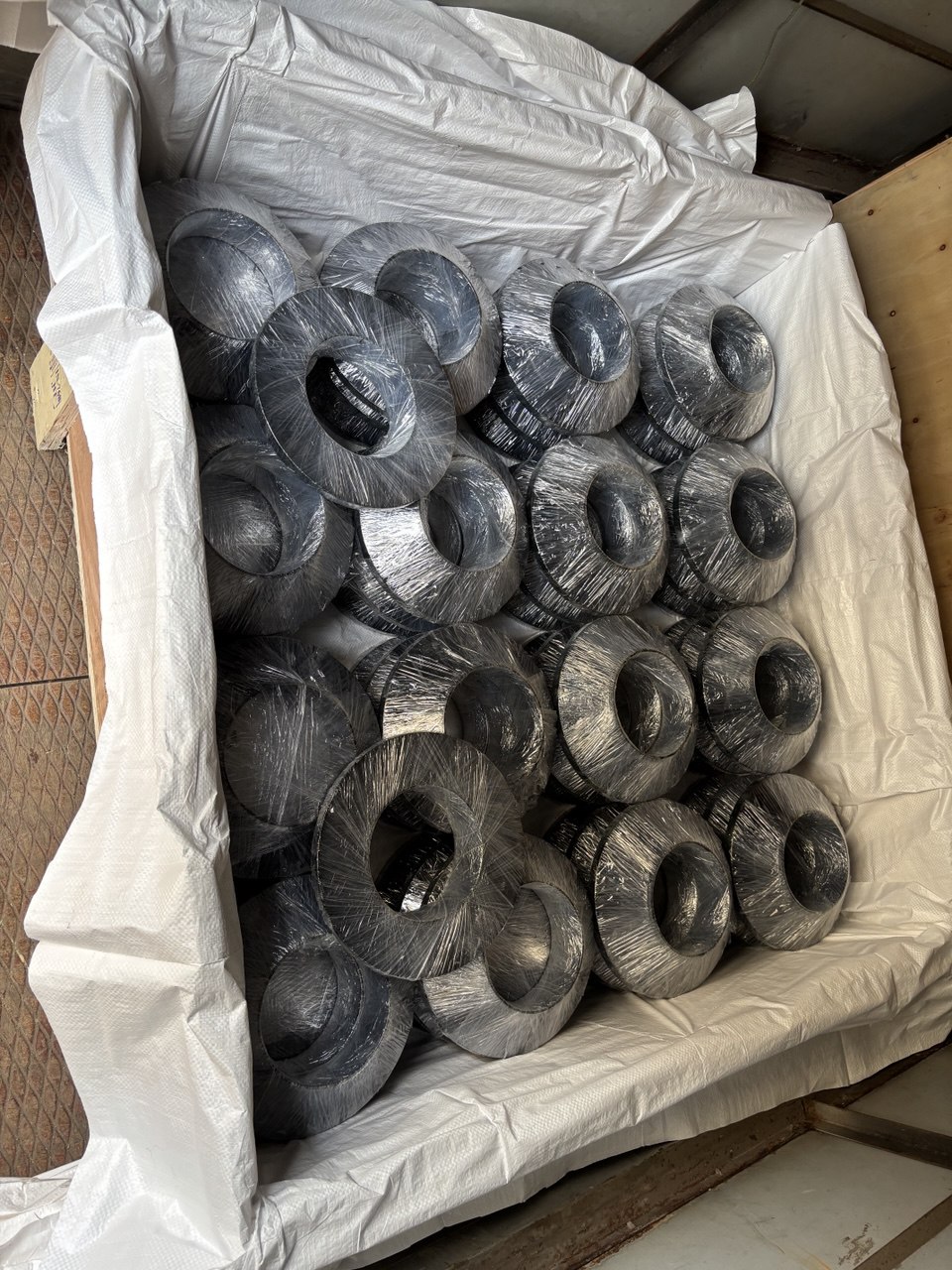 ASTM A350 LF2 LTCS low temperature carbon steel flanges packed in polybag-lined wooden export crate — Charpy impact tested flanges exporter Tesco Steel India