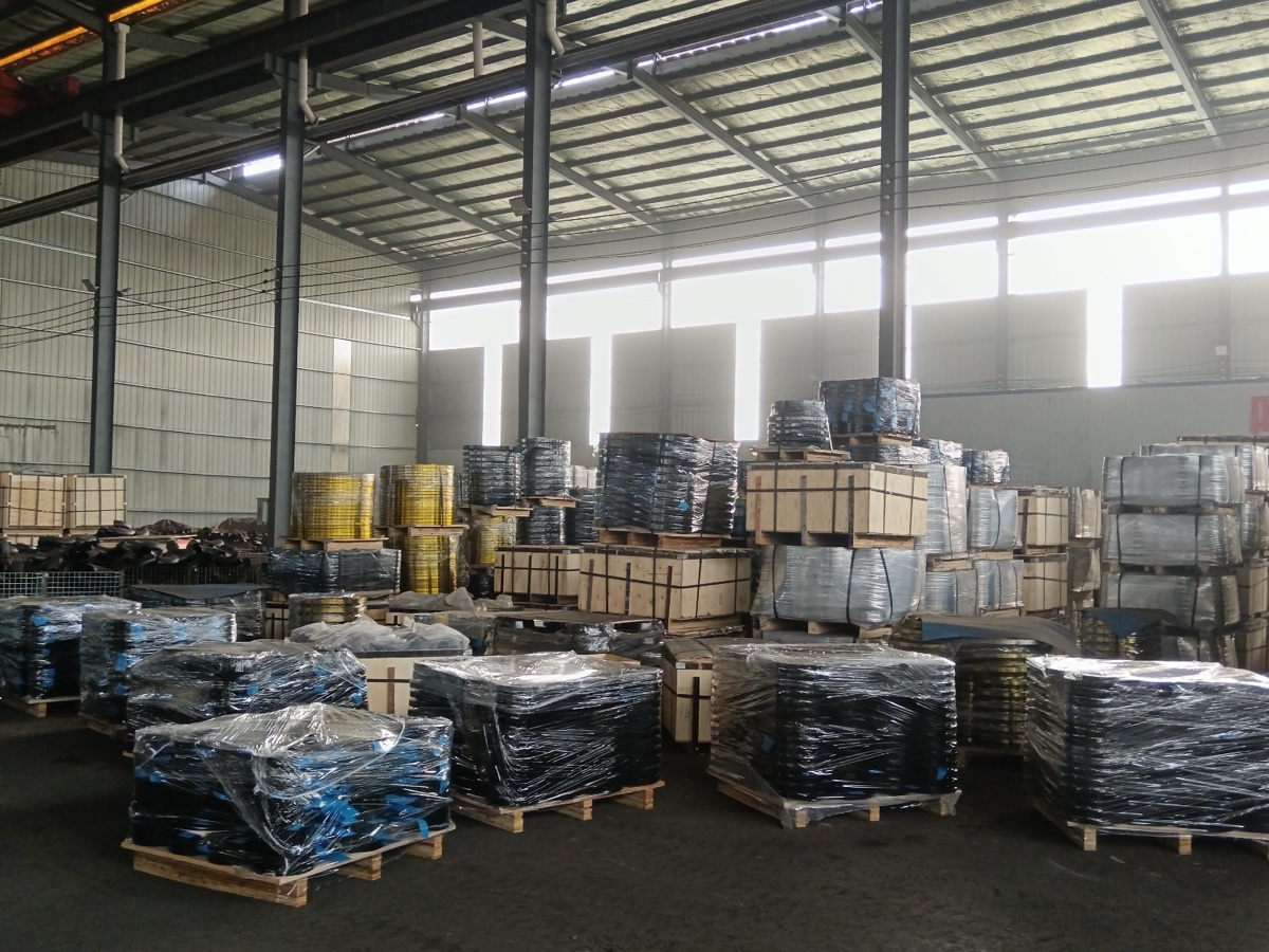 Palletised carbon steel flange stock shrink wrapped in the warehouse ready for export