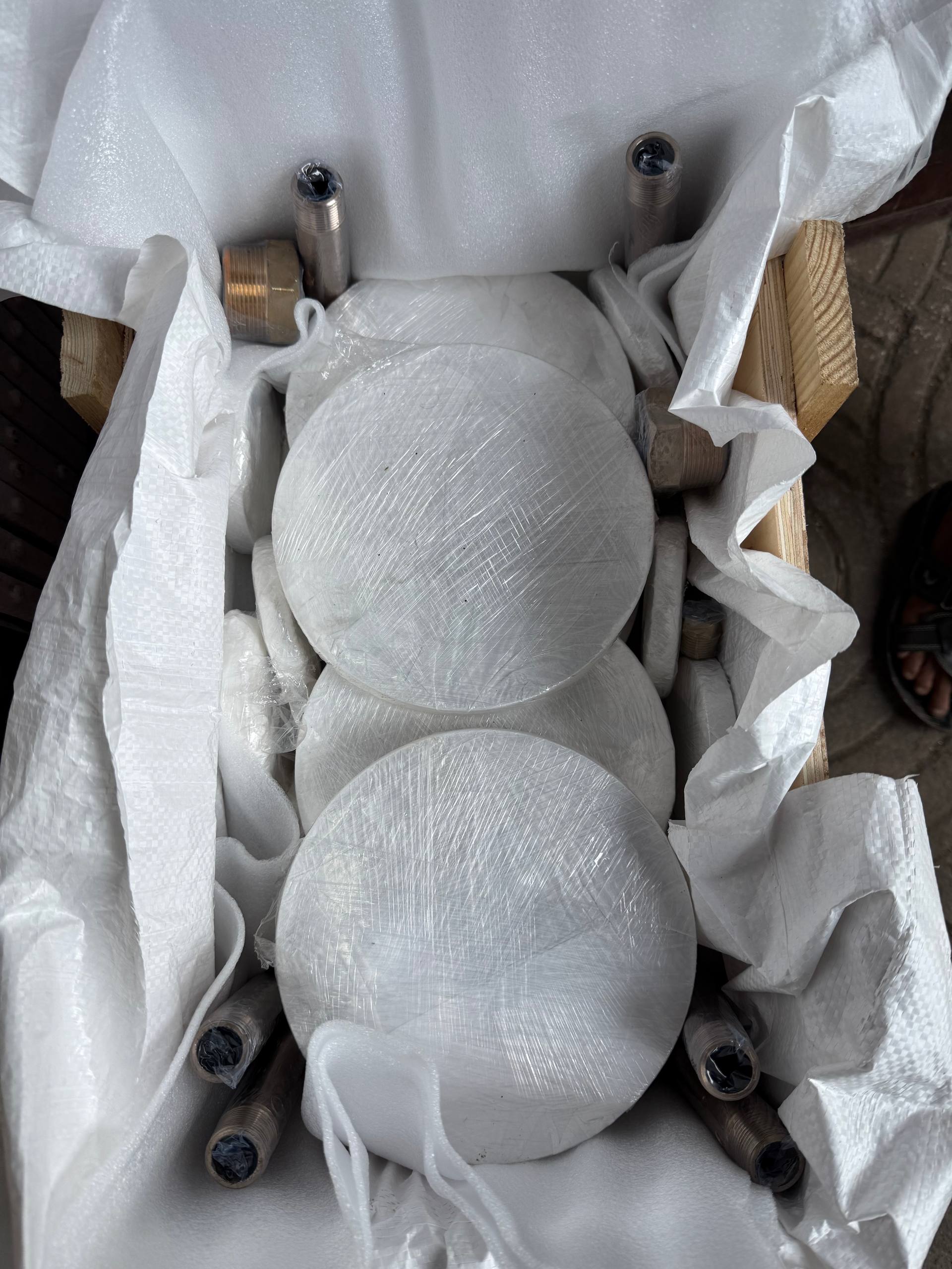 Cupro Nickel 90/10 C70600 flanges wrapped in bubble wrap and plastic film inside wooden export crate with stud bolts