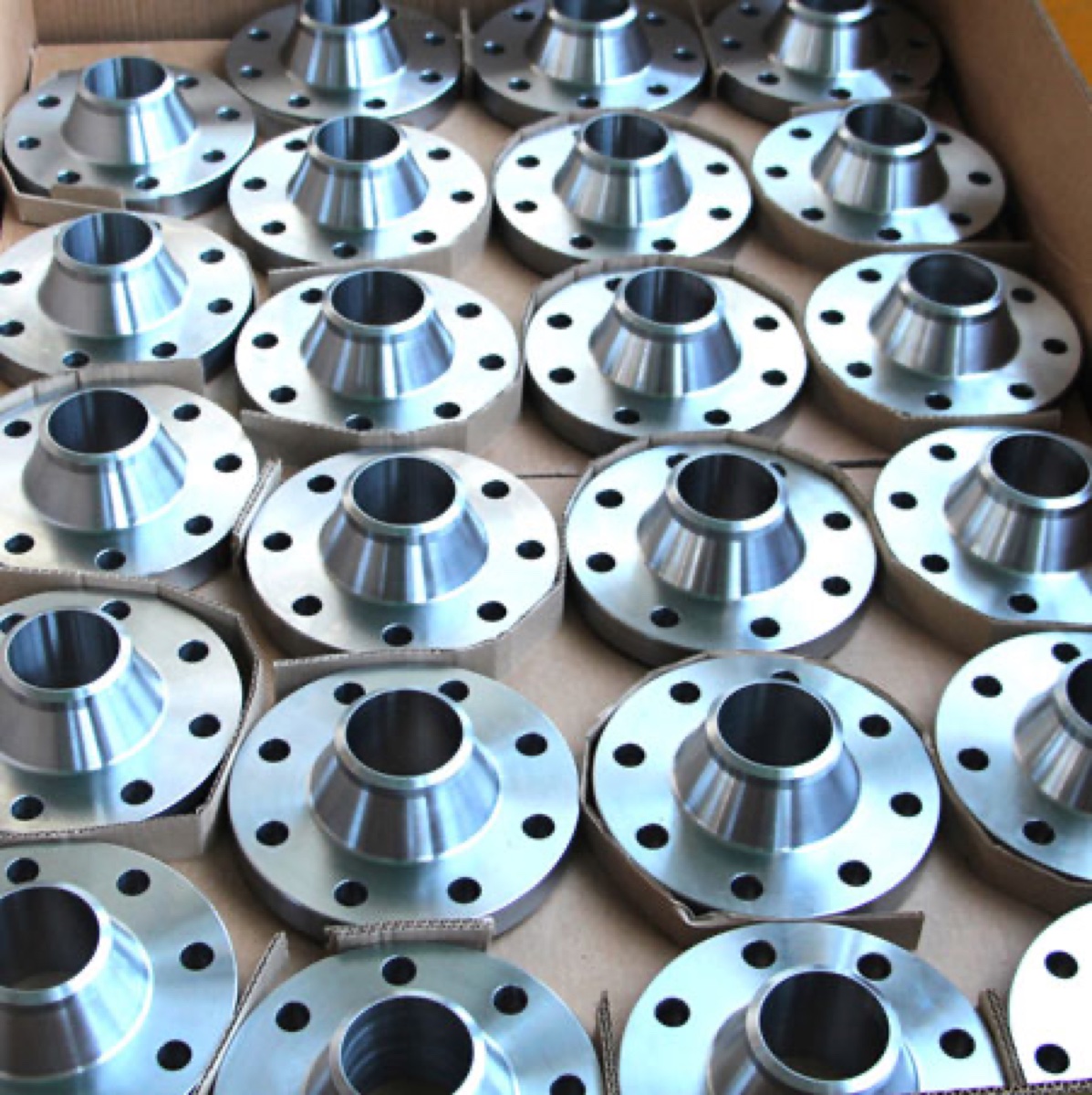 Inconel 625 weld neck flanges machined and packed in carton for dispatch — Tesco Steel & Engineering