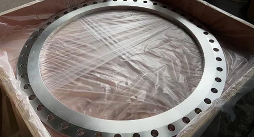 Large diameter slip on flange in film-lined wooden export crate at Tesco Steel & Engineering