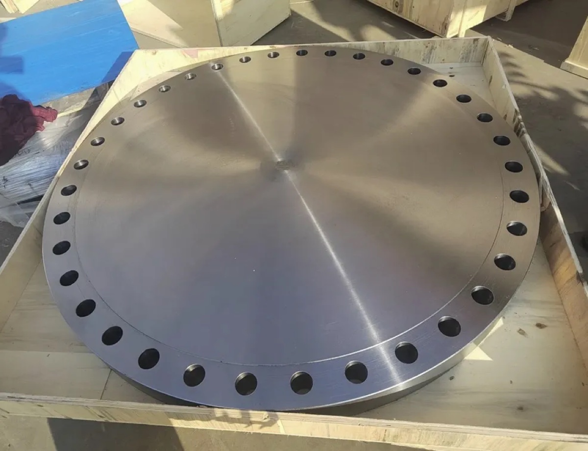 Very large machined alloy blind flange crated in wooden packing for export