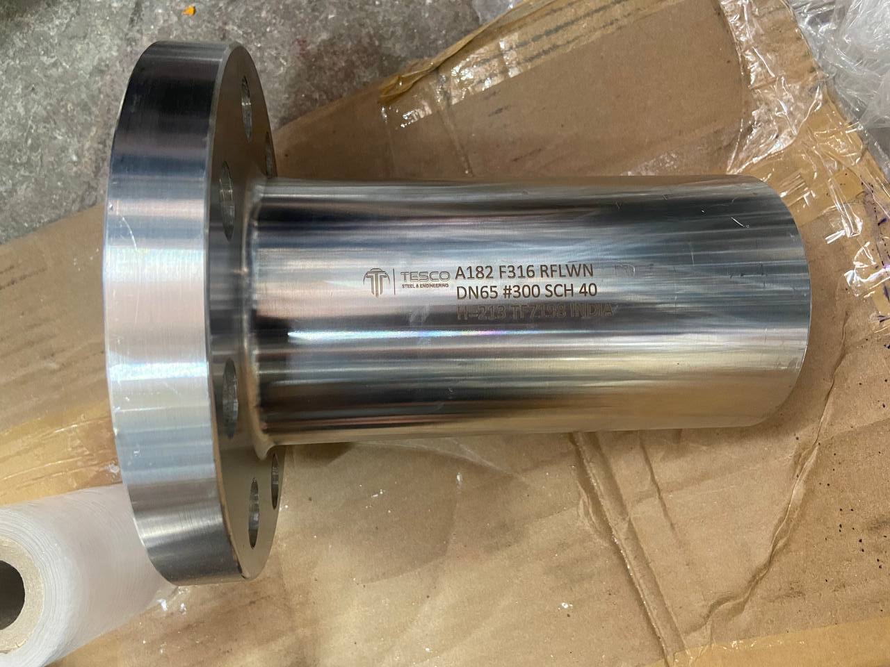 Long weld neck flange ASTM A182 F316 RFLWN, DN65 Class 300 Sch 40, hard-stamped and manufactured by Tesco Steel & Engineering