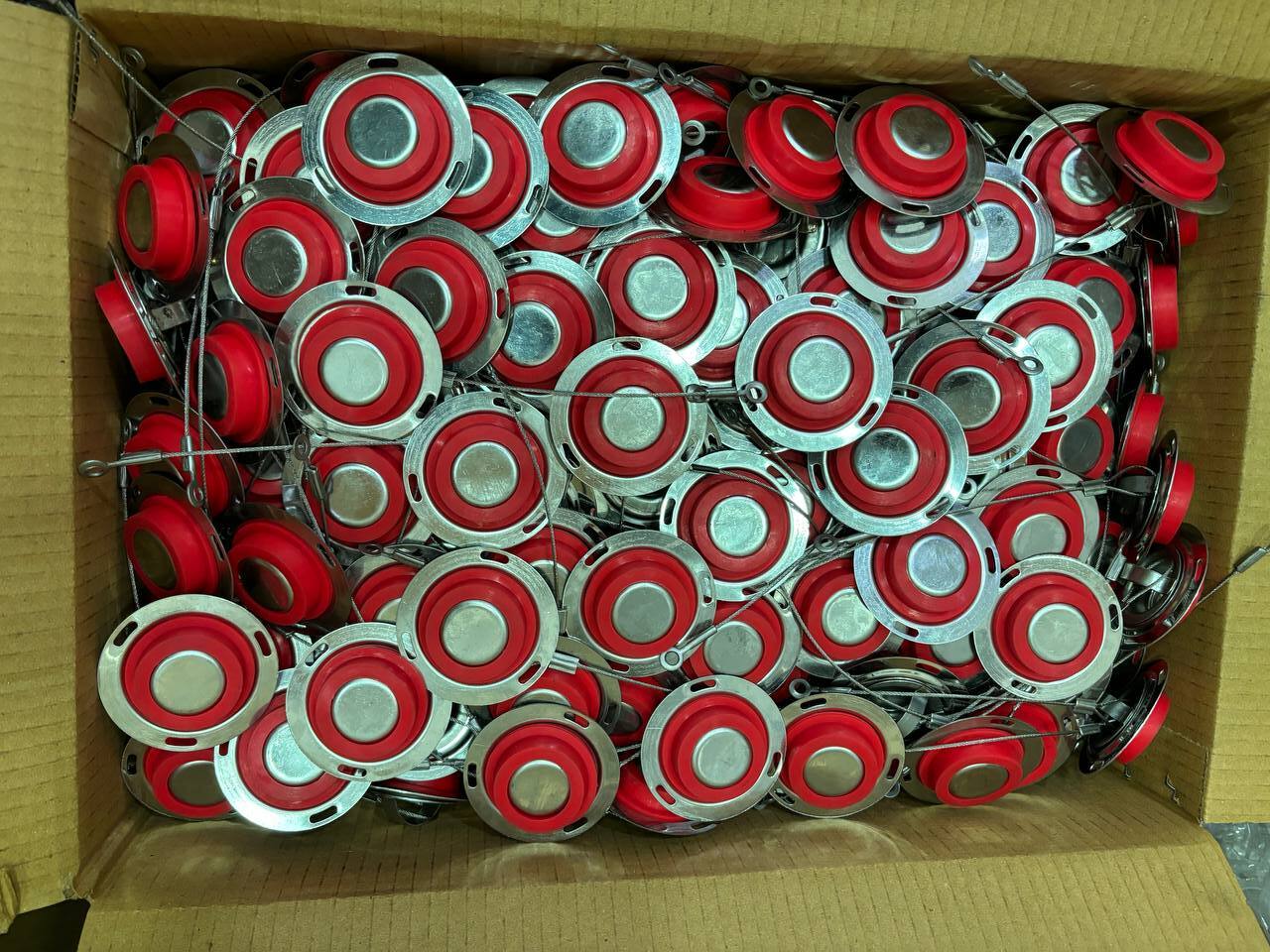 Bulk stock of silicone insulation inspection plugs with stainless steel flanges and lanyards ready for despatch from Tesco Steel & Engineering Mumbai