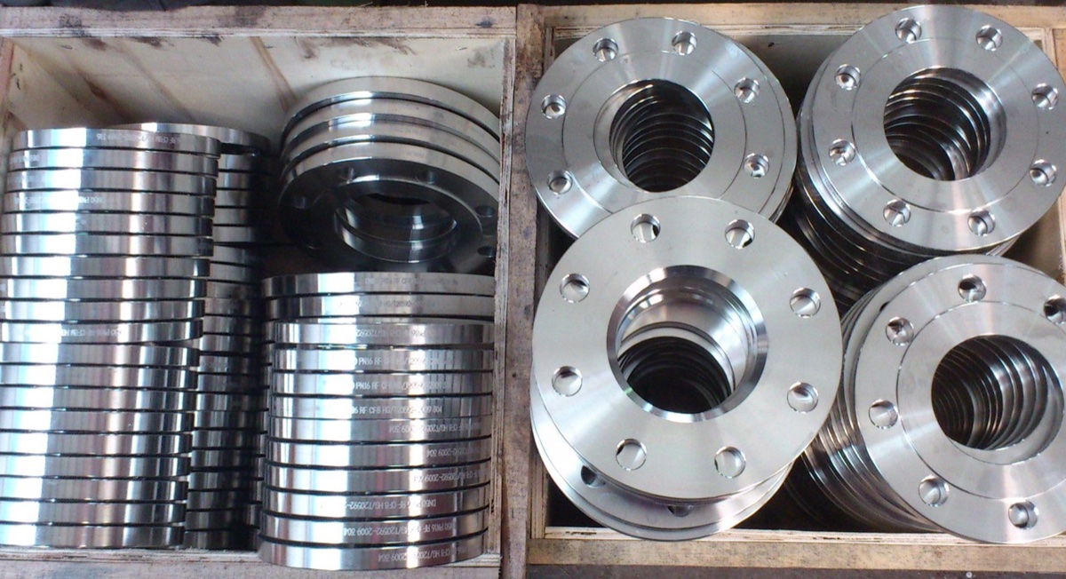 Marked slip on flanges crated by size in wooden boxes at flange works ready for despatch