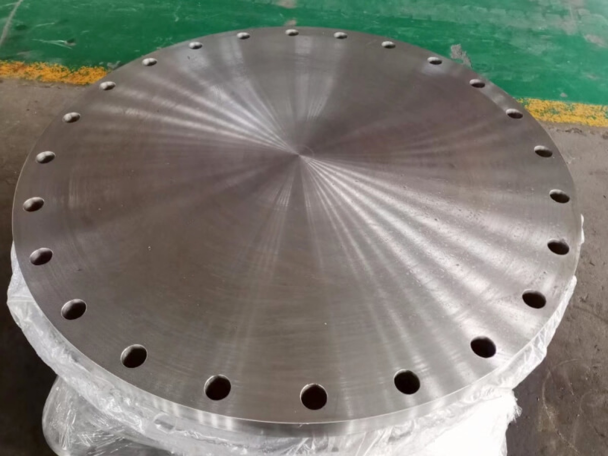 Machined blind flange with finished raised face at the flange works